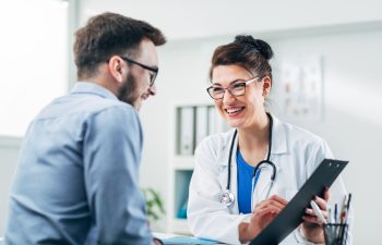 Doctor and patient sitting in doctor's office