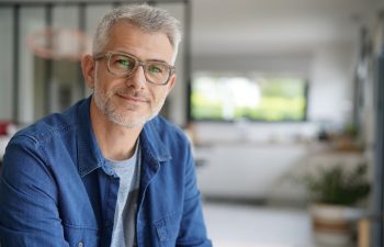 Middle-aged guy with eyeglasses and blue shirt