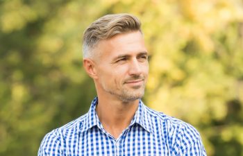 enjoy the weather. he radiates charisma. male beauty and fashion. young adult man in casual clothes. barber hair care. sexy adult man. handsome man with unshaven face. confident guy thinking outdoor.