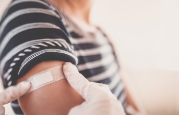 Woman and a doctor in the hospital after vaccination against Covid 19. Concept immunization and making injections from pandemic of SARS.