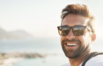 Cropped portrait of a handsome young man taking selfies while hiking in the mountains.