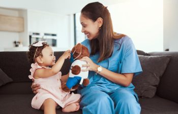 Pediatrician doctor consulting kid, teddy bear and happy healthcare checkup at home visit. Happy baby girl, occupational therapy and woman nurse therapist play in lounge for children wellness service.