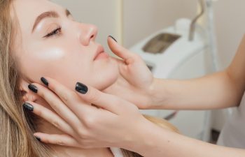 Woman getting face and body treatment at beauty clinic