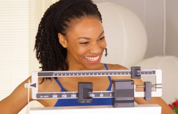African woman feeling very proud of herself