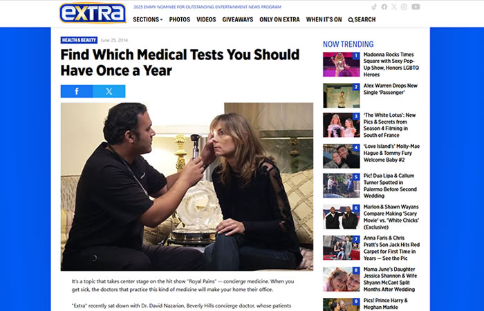 A male doctor examines a seated woman with an otoscope during a medical consultation, as shown on an online health news article titled 