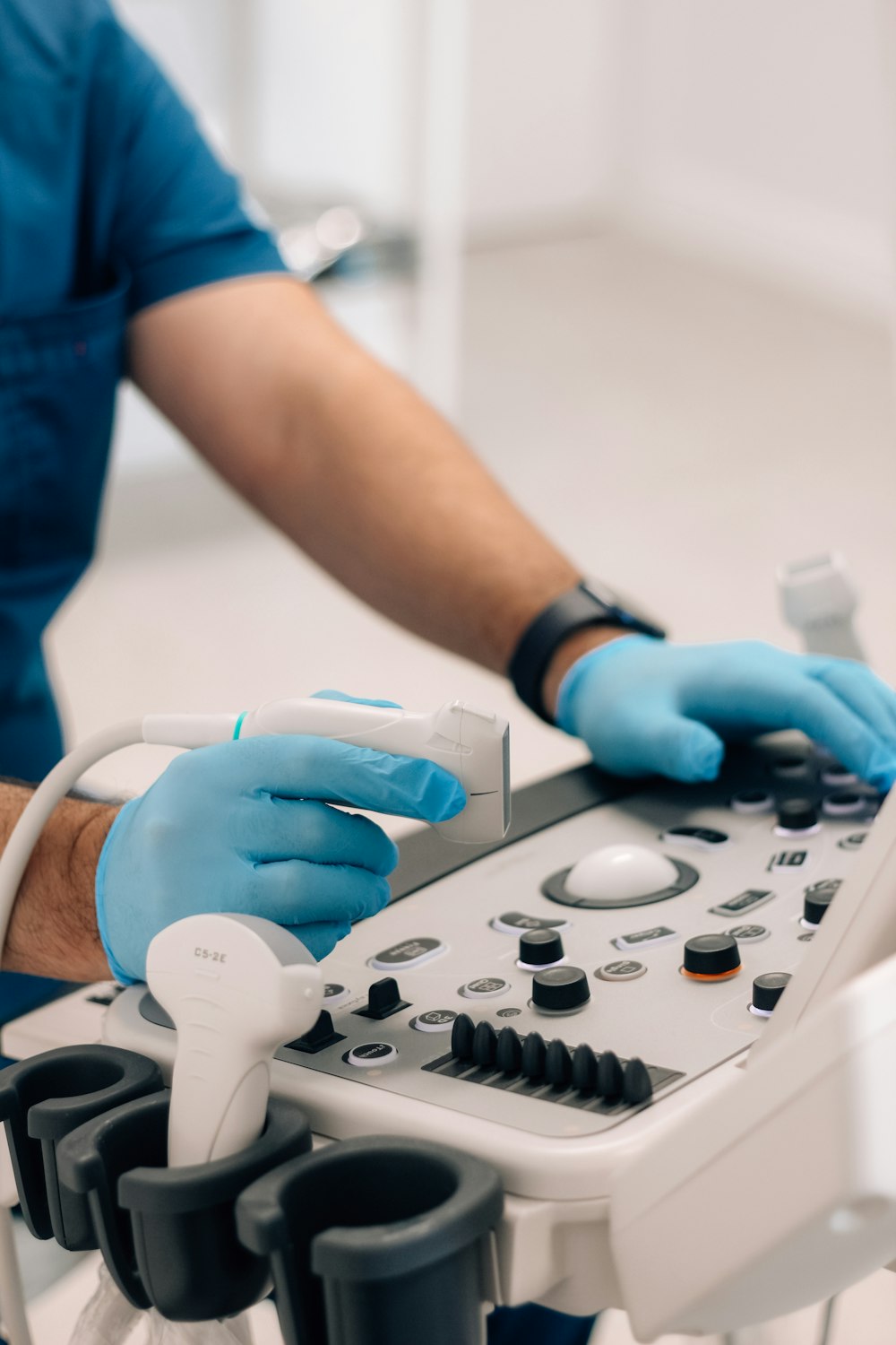 Clinician operating diagnostic ultrasound equipment