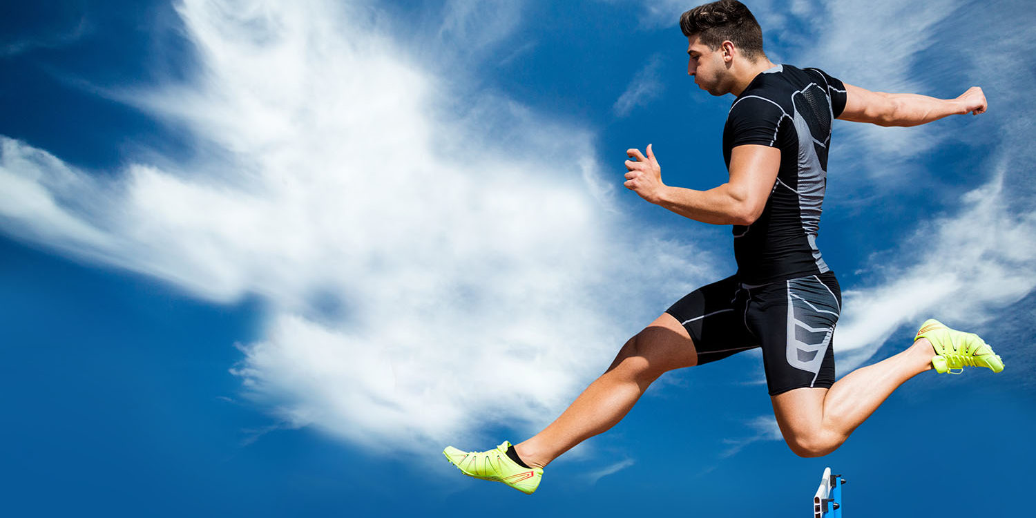 Male athlete jumping over the hurdles - MY CONCIERGE MD