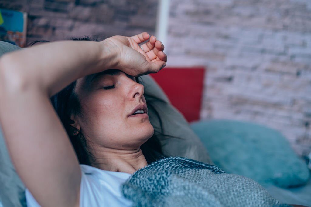woman having night sweat during menopause